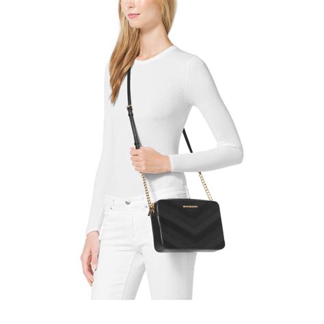 michael kors jet set travel large crossbody black silver|Michael Kors jet set silver.